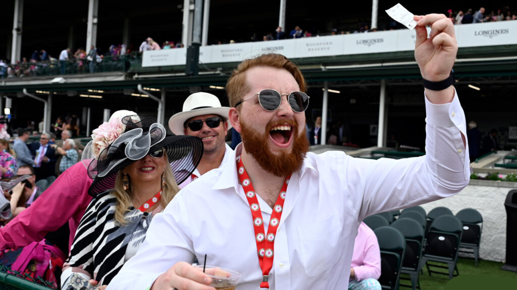 Patron with a betting ticket at the Kentucky Derby.